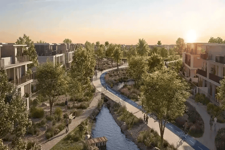 Alva at The Valley by Emaar, canal-side park with cycling paths and townhouses at sunset